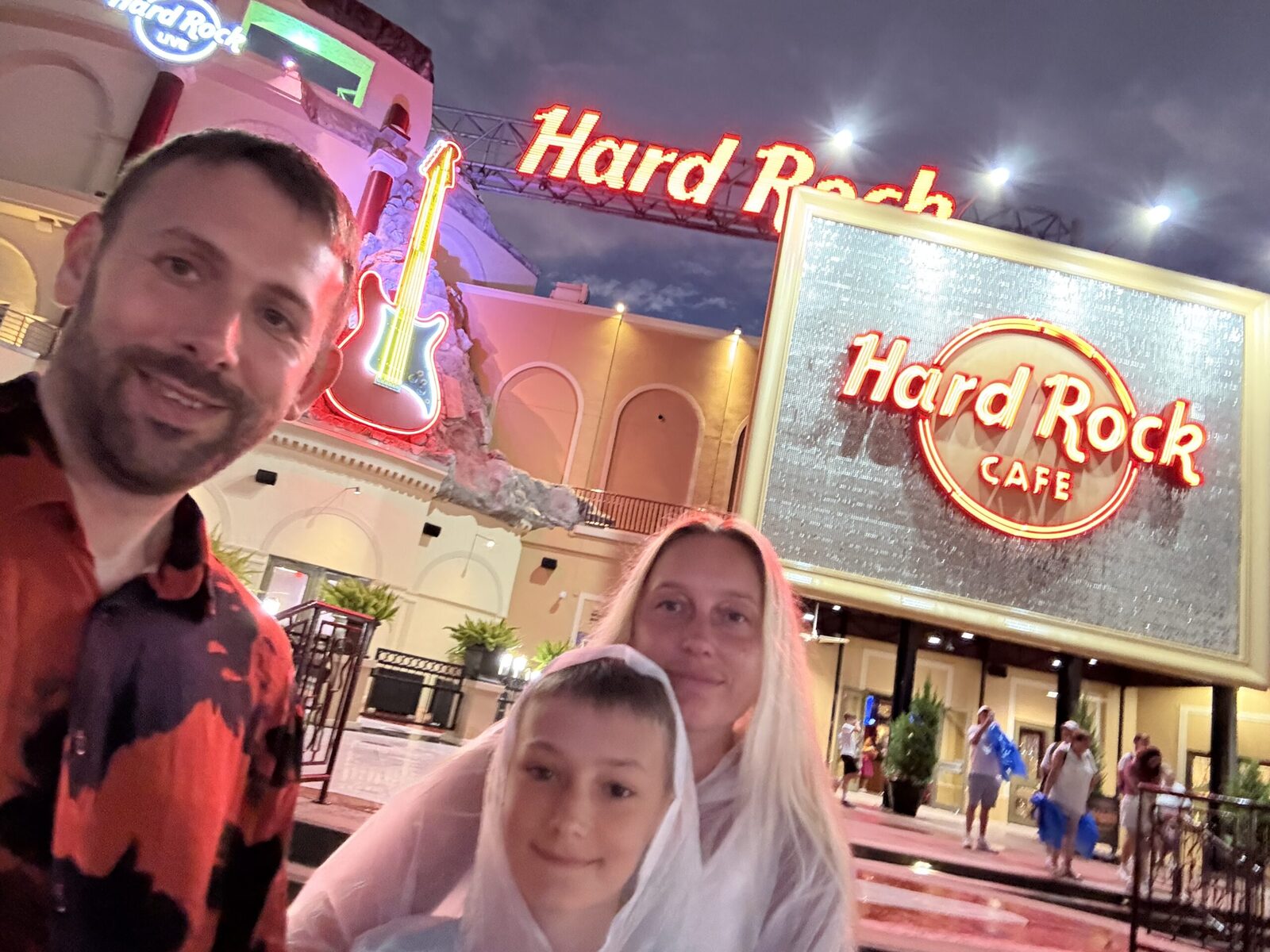 Will, Amie and Austin outside the Hard Rock Cafe during a family trip
